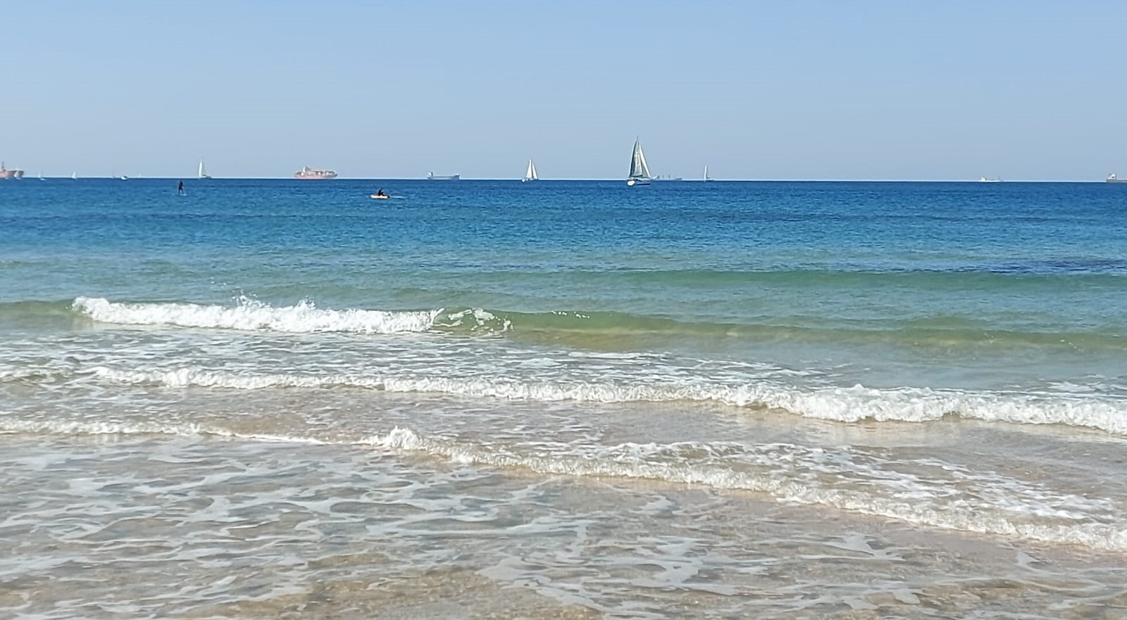 surfers and boats